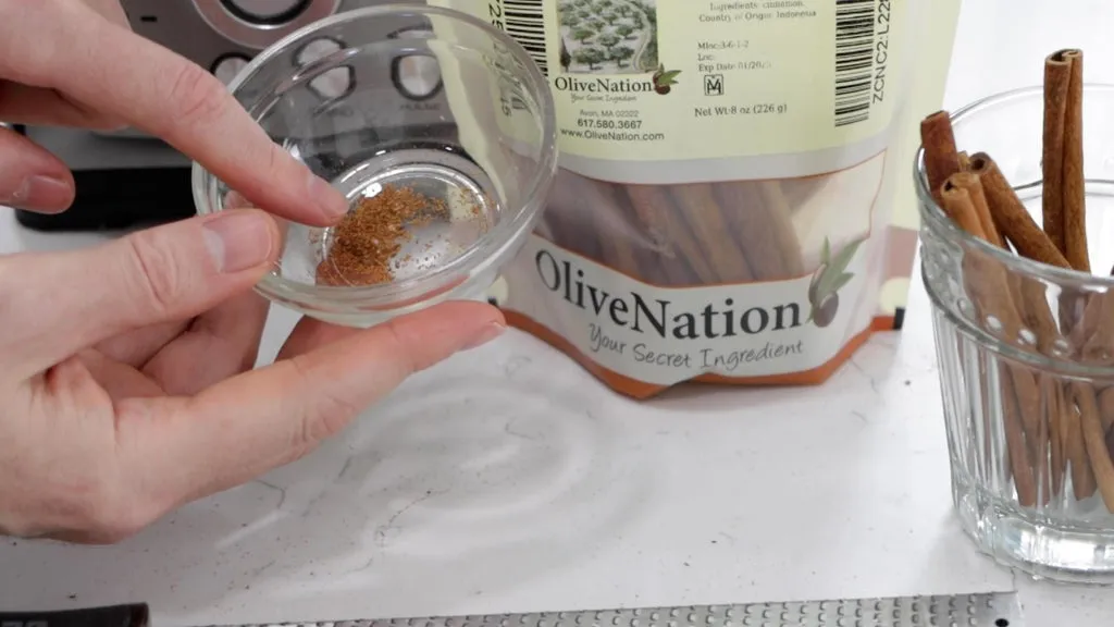 Cinnamon powder in a glass bowl.