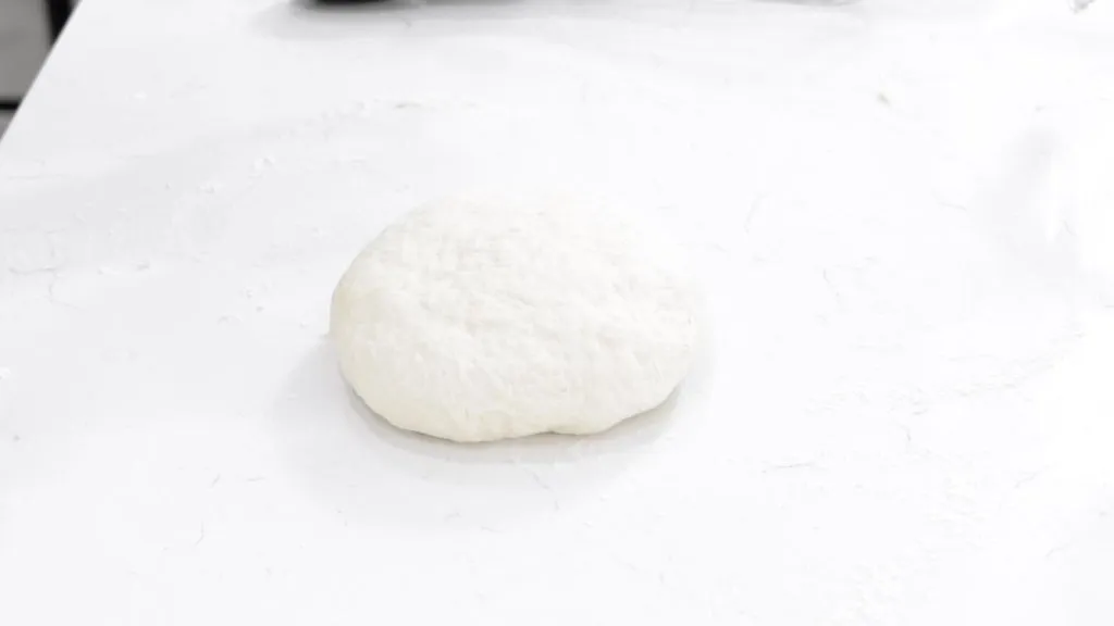 Finished Indian fry bread dough on a white counter.