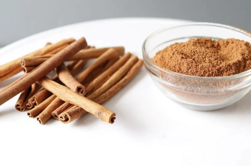how to make ground cinnamon from cinnamon sticks bowl of cinnamon on white plate