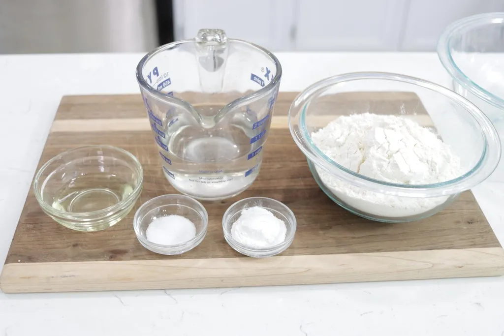 5 glass bowls filled with frybread ingredients.