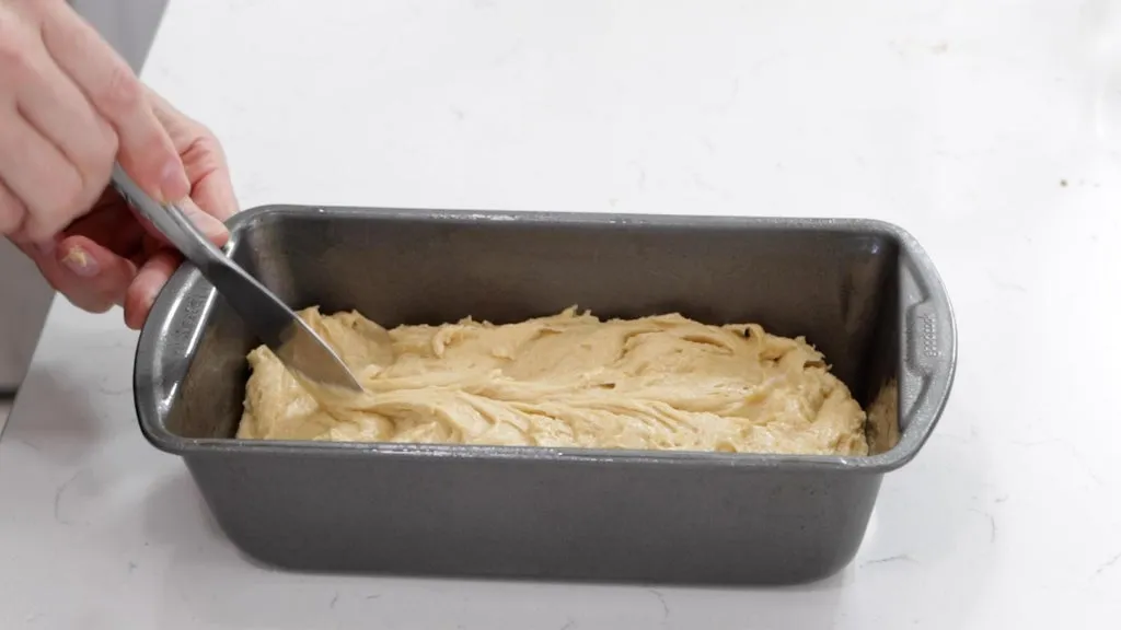 Peanut butter bread batter in a bread loaf pan. 