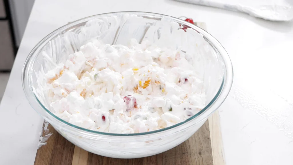 Finished ambrosia salad in a large glass bowl.