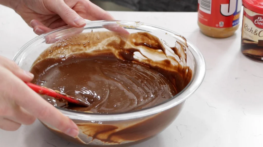 melted 2 ingredient fudge in a medium glass bowl.