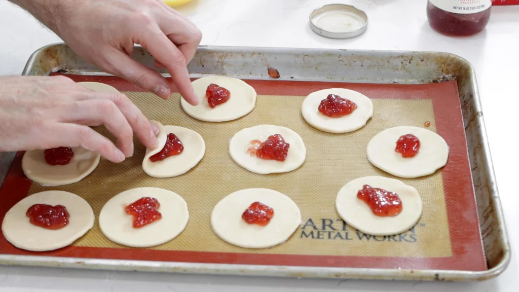 Hand folding the hamantaschen