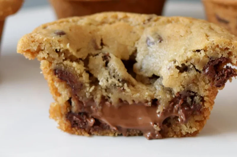Nutella stuffed cookie cups on a white plate.