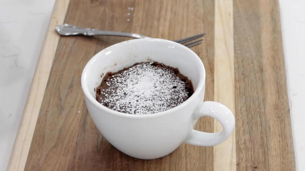 Finished chocolate mug cake ready to be eaten.