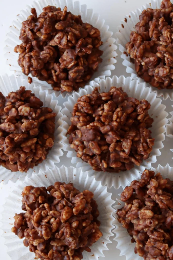 Several chocolate crackles on a white plate. 