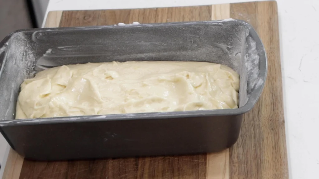 Lemon cake batter in a bread loaf pan.