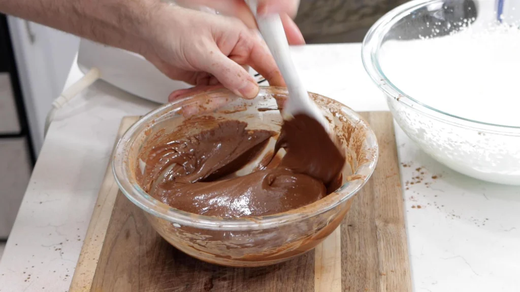 Bowl of sweetened condensed milk and cocoa powder.