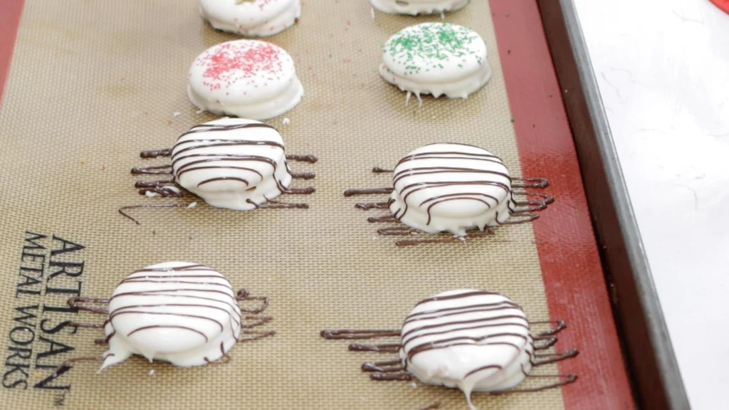 White chocolate covered ritz crackers with dark chocolate drizzled on top.