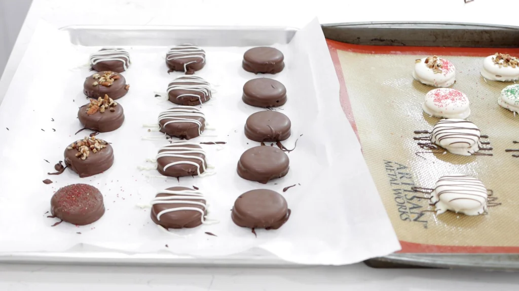 Finished chocolate covered ritz crackers on a sheet pan