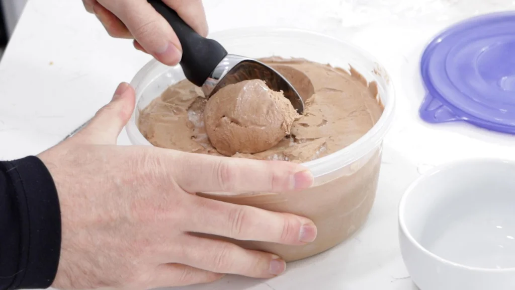 Spoon scooping 3-ingredient homemade chocolate ice cream.