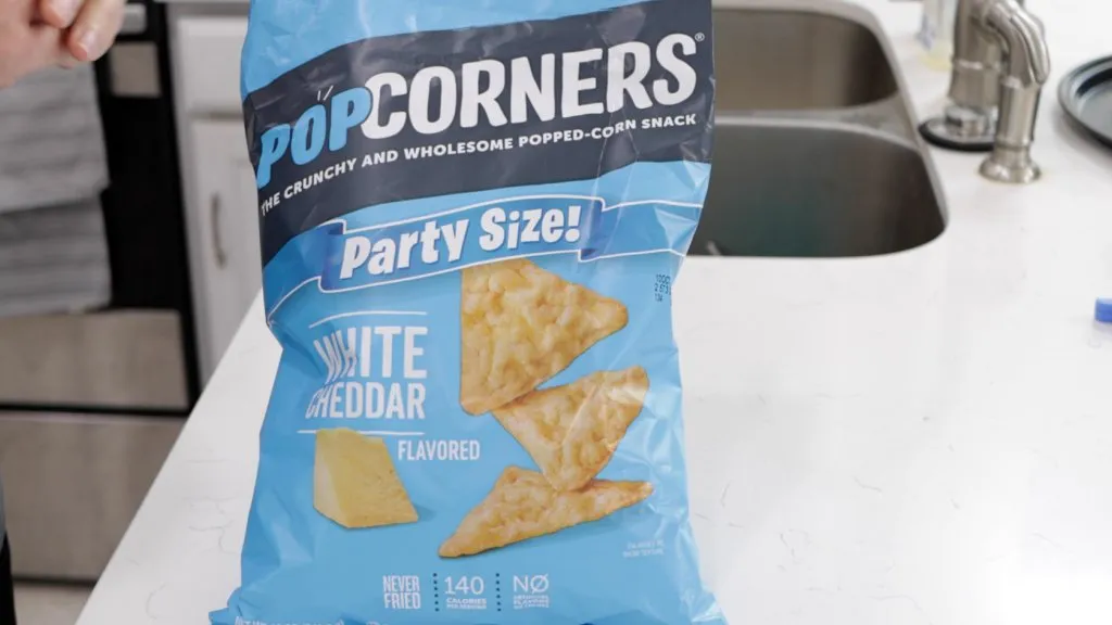 Popcorners bag of white cheddar snacks on a counter.