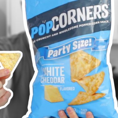 Popcorners bag in a hand next to a hand holding one.