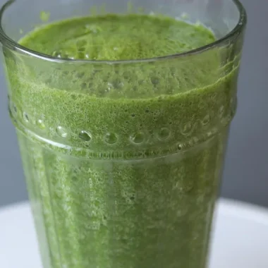 Easy homemade green smoothie on a white plate