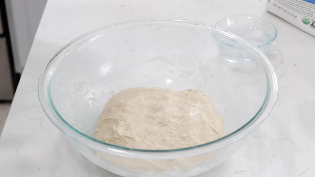 Dough in a glass bowl. 