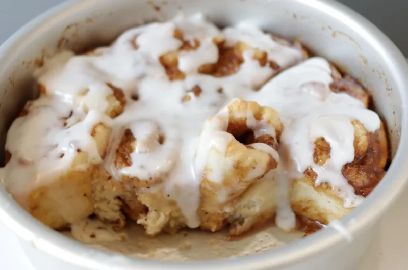 Round cake pan full of 2-ingredient dough cinnamon rolls
