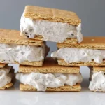 Stack of 3-ingredient cookies and cream ice cream sandwiches.
