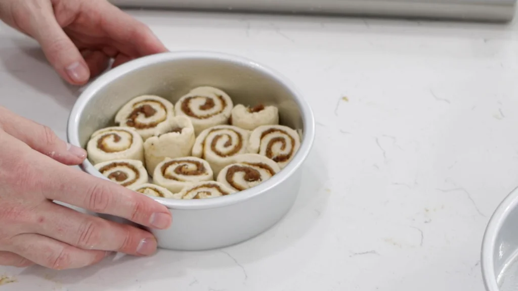 2-ingredient dough cinnamon rolls in a round 6-inch cake pan.