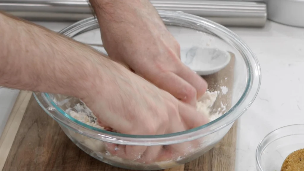 Mixing dough with fingers