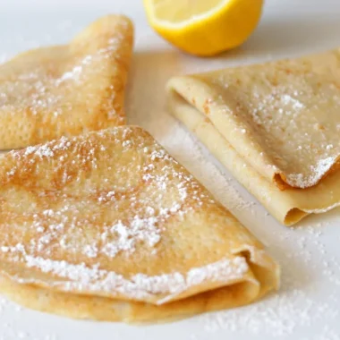 Gluten free crepes on a white plate.