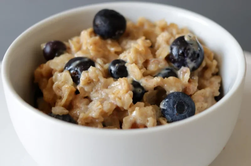 Bowl of homemade oatmeal with blueberries made on the stovetop