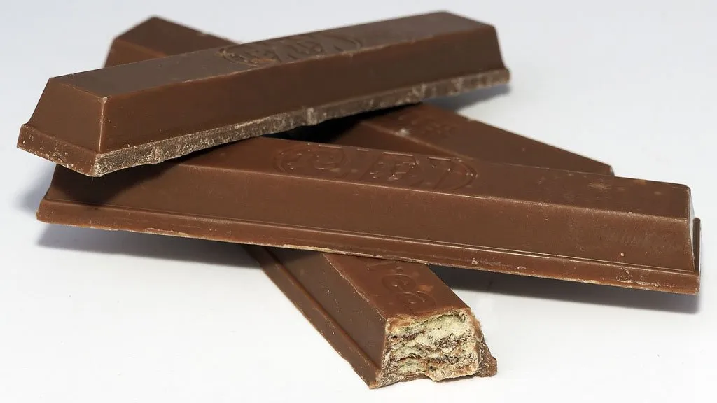 Kit Kat bars on a white counter. 4th most popular candy in America