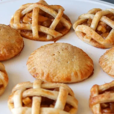 Plate full of apple pie cookies.