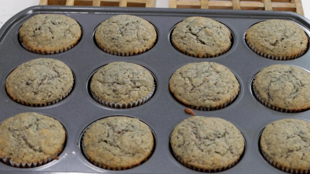 Freshly baked homemade fig muffins still in the muffin pan. Freshly baked homemade fig muffins still in the muffin pan.