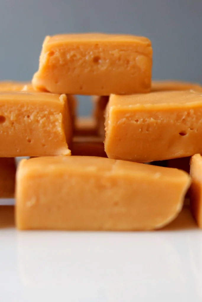Squares of butterscotch fudge on top of each other creating a pyramid. Squares of butterscotch fudge on top of each other creating a pyramid.