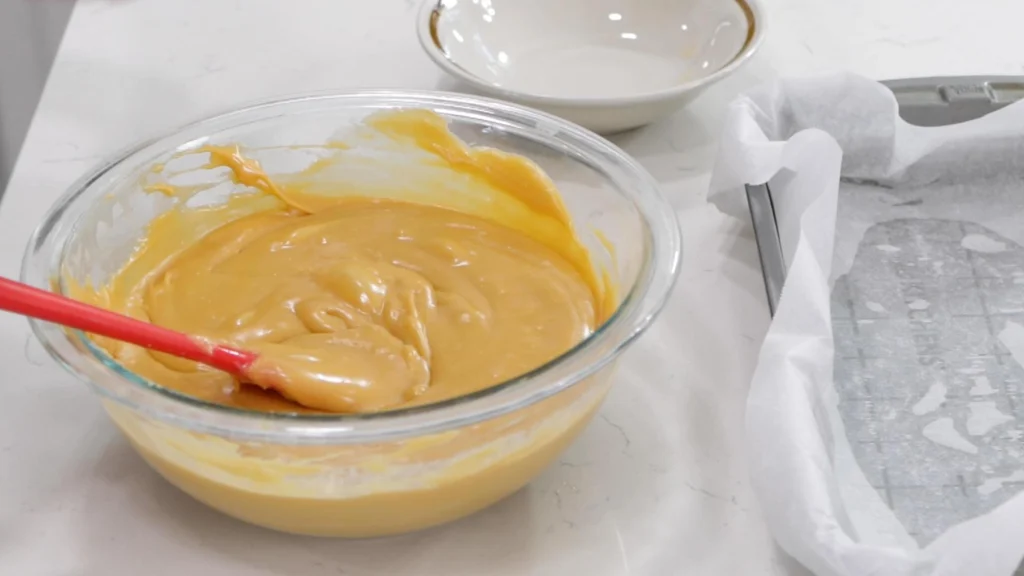 hot butterscotch fudge in a medium glass bowl. hot butterscotch fudge in a medium glass bowl.