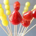 Several tanghulu in a glass bowl.