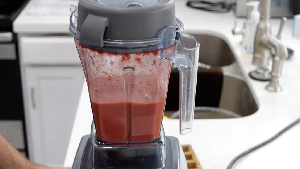 Strawberry fruit leather base in a blender. Strawberry fruit leather base in a blender.