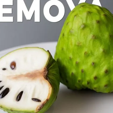 Atemoya fruit on a white plate, with half slice next to a whole fruit.