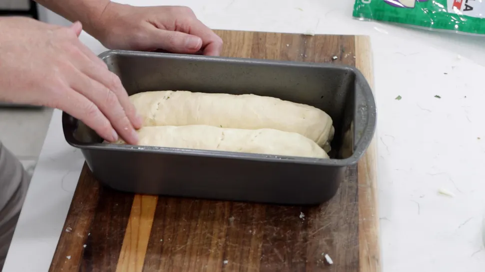 Loaves of crescent roll dough in a bread loaf pan. Loaves of crescent roll dough in a bread loaf pan.