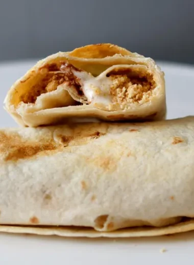 Half of an air fryer smorrito resting on another one.